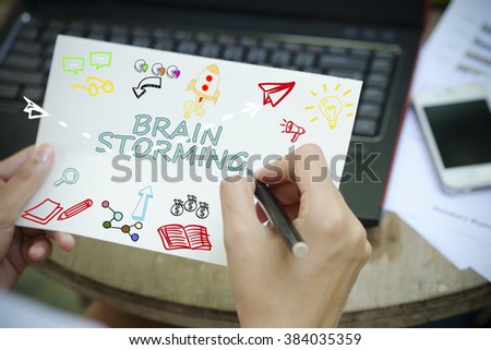 hand drawing BRAIN STORMING concept on white notebook , business concept , business idea , strategy concept