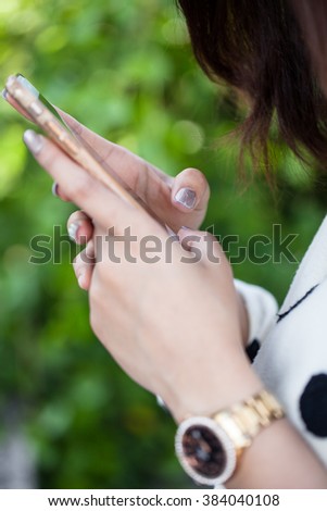 Female hand using a smartphone
