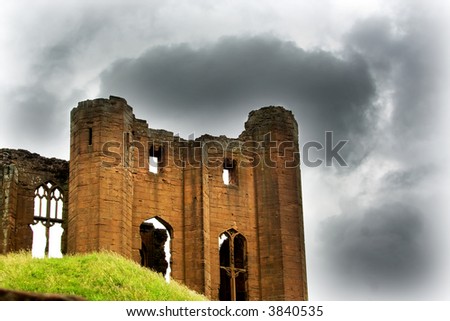 Ruins of castle with stormy clouds in background