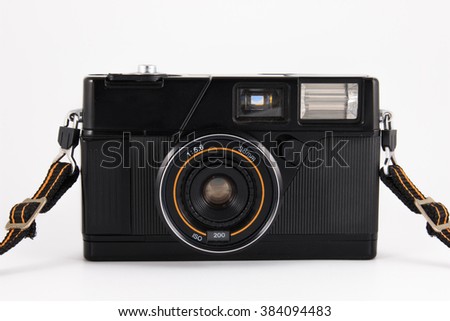 Old camera, vintage camera films popular in the past on white background.
