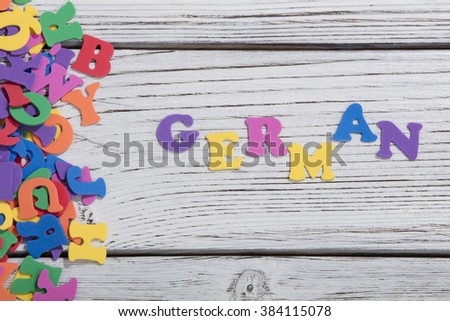 colorful words german on white wooden background
