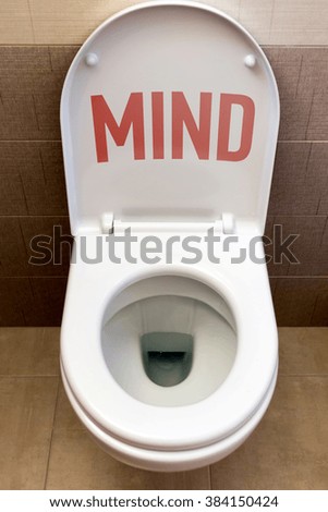 Toilet with an inscription "Mind"