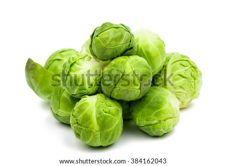a pile of Brussels sprouts on a white background Royalty-Free Stock Photo #384162043