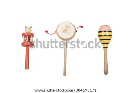 Wooden rattles and drum on a white studio background