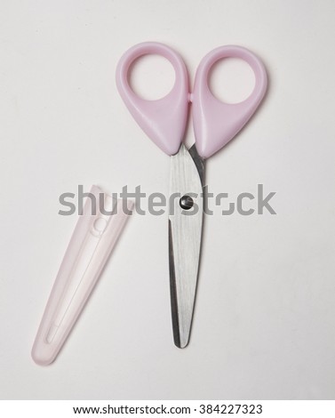a pink scissor isolated with shadows