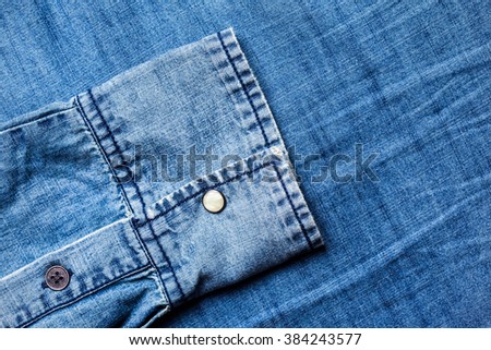 Blue jeans background with folds close-up image
