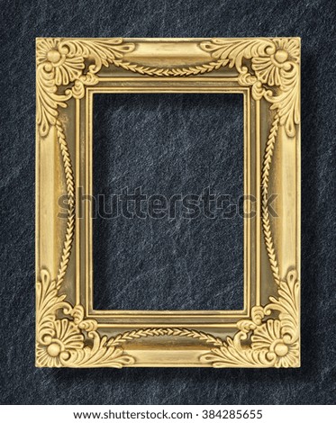 gold frame on black slate background