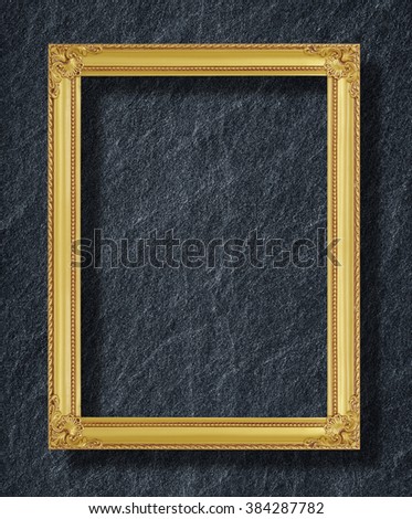 gold frame on black slate background