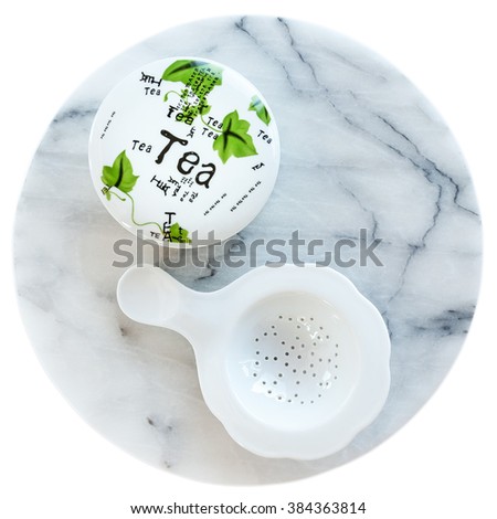 Tea set on marble tray isolated on white background.