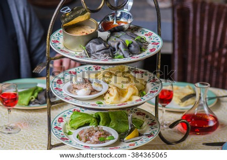 Pancakes in stock with fish and seafood snacks. Feast on Shrovetide , the holiday before Easter. Close-up of served table restaurant.