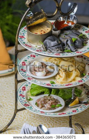 Pancakes in stock with fish and seafood snacks. Feast on Shrovetide , the holiday before Easter. Close-up of served table restaurant.