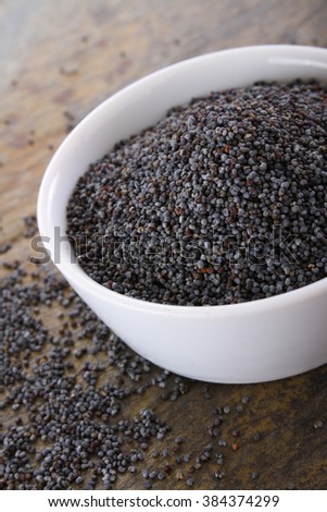 healthy poppy seeds in white dish