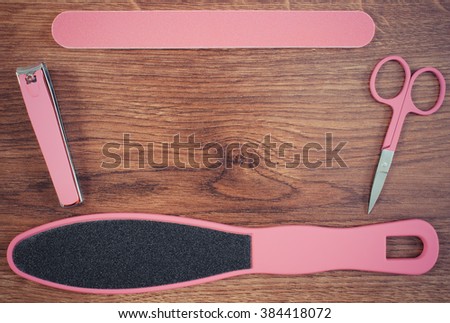 Vintage photo, Accessories for manicure or pedicure, nail file, scraper, scissors, nail clippers, concept of nail, hand and foot care, copy space for text or inscription
