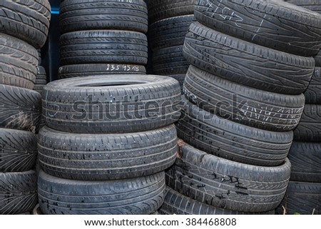 Picture closeup on hands choosing a tire or tyre