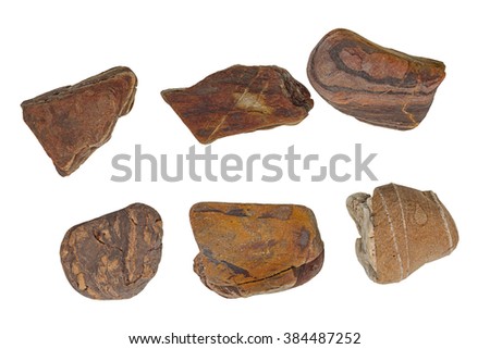 collection of ocean stones close-up isolated on white background.