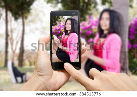 capture photo beautiful woman with smartphone,close up