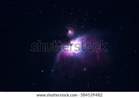 The Great Orion Nebula dark background with a soft focus.