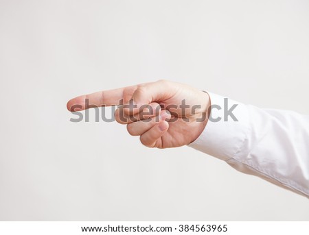 Male hand indicating sideways, white background
