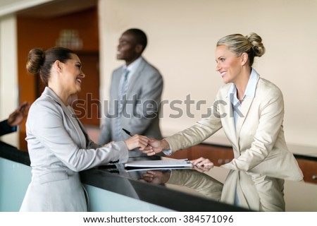businessman check in at hotel reception