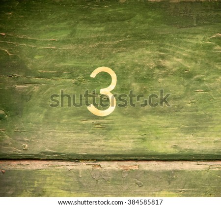 number 3 on wooden wall