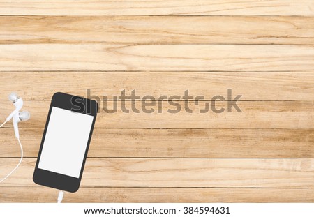 mobile and on wooden background,copy space for text