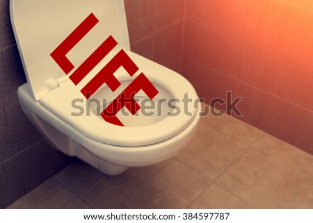Toilet with an inscription "Life"
