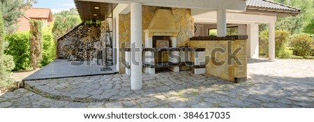 Panoramic view of outdoor relaxation area with fireplace