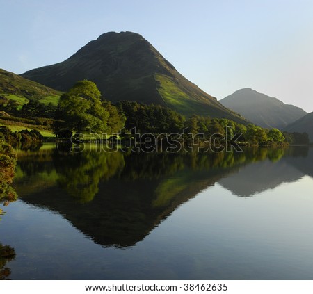 Yewbarrow reflected in Wastwater on a calm late summer morning Royalty-Free Stock Photo #38462635
