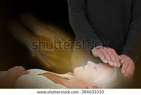 Spiritual Healing Session -  male healer channeling healing energy to female with the help of a spirit healing guide Royalty-Free Stock Photo #384633310