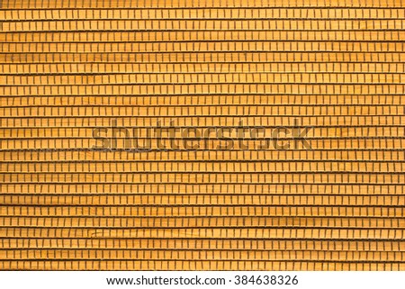 Wooden planks stitched with threads