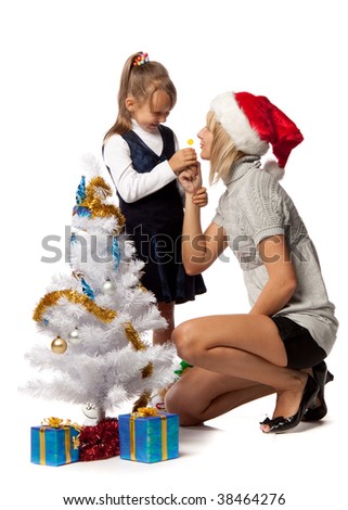 The nice girl with mum decorates a Christmas tree on a white background.