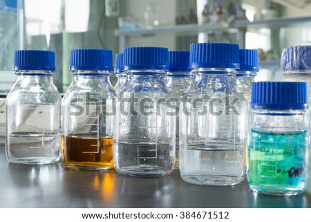 Close-up of chemical bottles in laboratory.