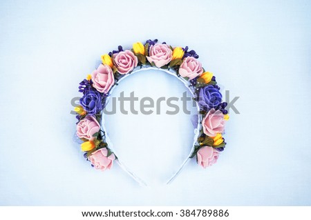 Hoop from flowers, wreath with colored flowers. Handmade flowers wreath on white. Accessory. Artificial flowers. Hair accessories. Beauty. Fashion. Decoration for the head. Wreath hair