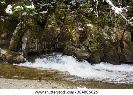 Stone. Water surface. Waterfall