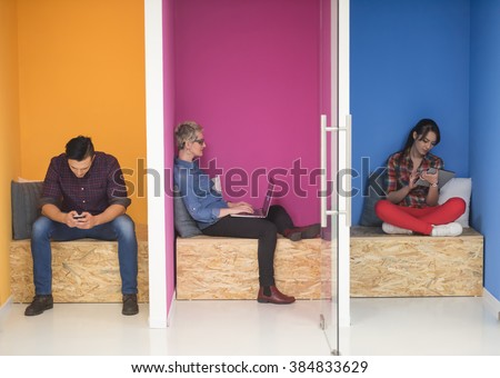 group of young business people having fun, relaxing and working in creative room space at modern startup office Royalty-Free Stock Photo #384833629