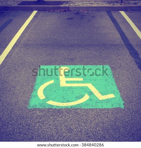 Handicapped parking spot. Retro filtered style.