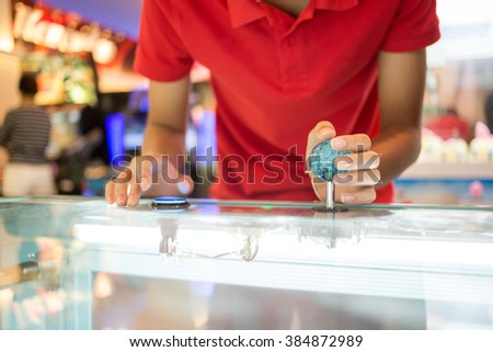 Close up hand control joystick of arcade,Vintage tone. Royalty-Free Stock Photo #384872989