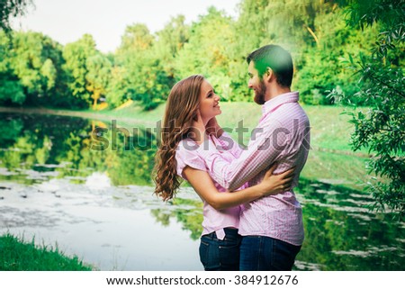 Love story. Young couple in the summer park