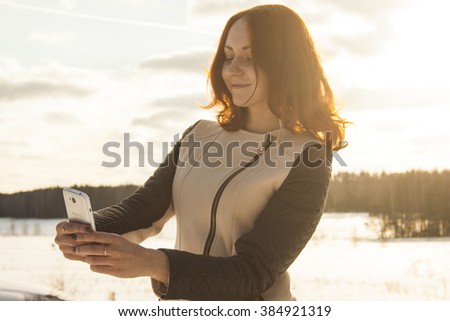 redhead girl takes a picture of his face