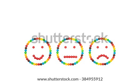 Emotional signs of colored glazed candies isolated on white background. The concept of the spectrum of emotions - joy, thoughtfulness, sadness