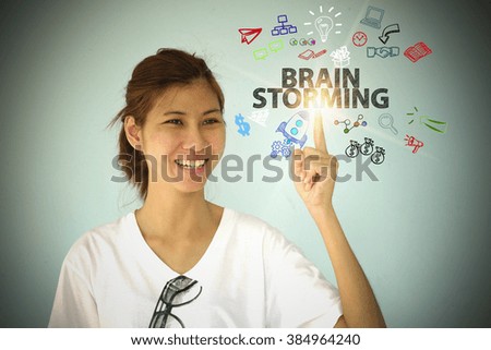 young woman smiling and hand pointing at BRAIN STORMING  concept , business concept , business idea 
