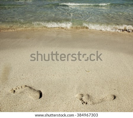 a footprints in the sand on the beach