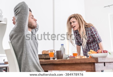 Couple fighting in the morning. woman screaming to her man. relationship problems Royalty-Free Stock Photo #384978976