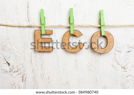 Eco word made of wooden letters on a white background old