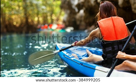 family kayaking and makes selfie
 Royalty-Free Stock Photo #384999205