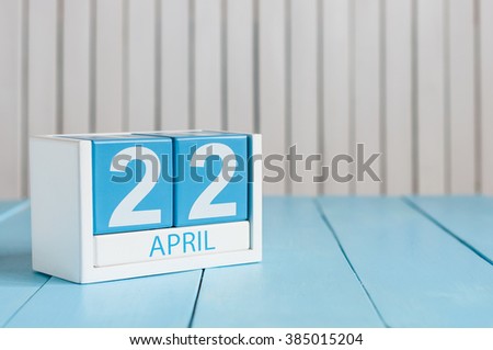 April 22nd. Earth Day. Image of april 22 wooden color calendar on white background.  Spring day, empty space for text Royalty-Free Stock Photo #385015204