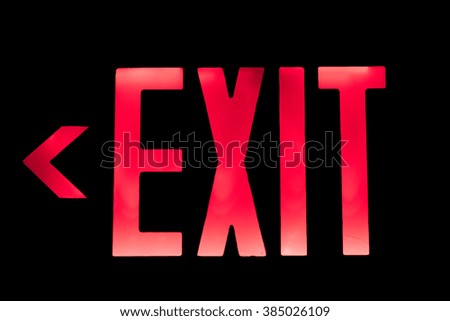 Lit Red Exit Sign pointing to the Left