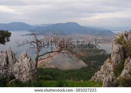 View over Iztuzu beach, Sulungur lake and Dalyan river delta in Turkey on a cloudy winter day.