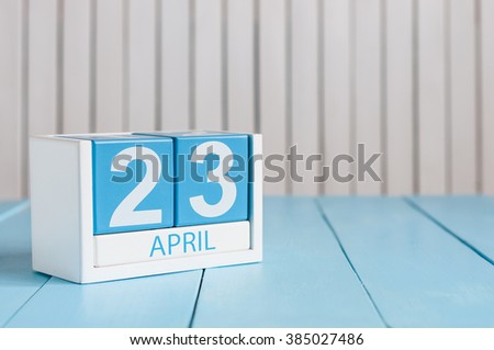 April 23rd. World Book Day. Image of april 23 wooden color calendar on white background.  Spring day, empty space for text Royalty-Free Stock Photo #385027486