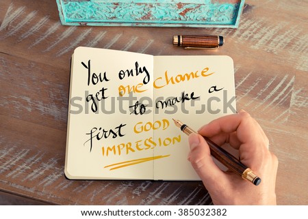 Retro effect and toned image of a woman hand writing a note with a fountain pen on a notebook. Handwritten text You Only Get One Chance To Make a First Good Impression as business concept image Royalty-Free Stock Photo #385032382